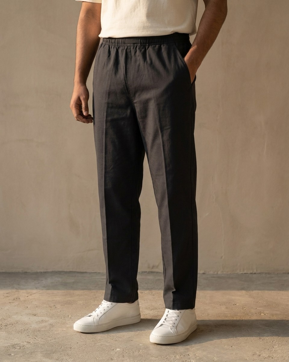 Desire Cotton — the Everyday Trouser in matte black cotton, full leg and elastic waistband